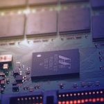 Detailed image of an electronic circuit board showing microchips and intricate wiring in a modern business technological setting.